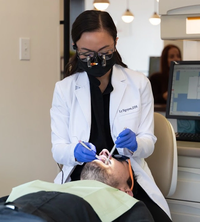 smiling patients after cosmetic dentistry treatment at iO Dentistry